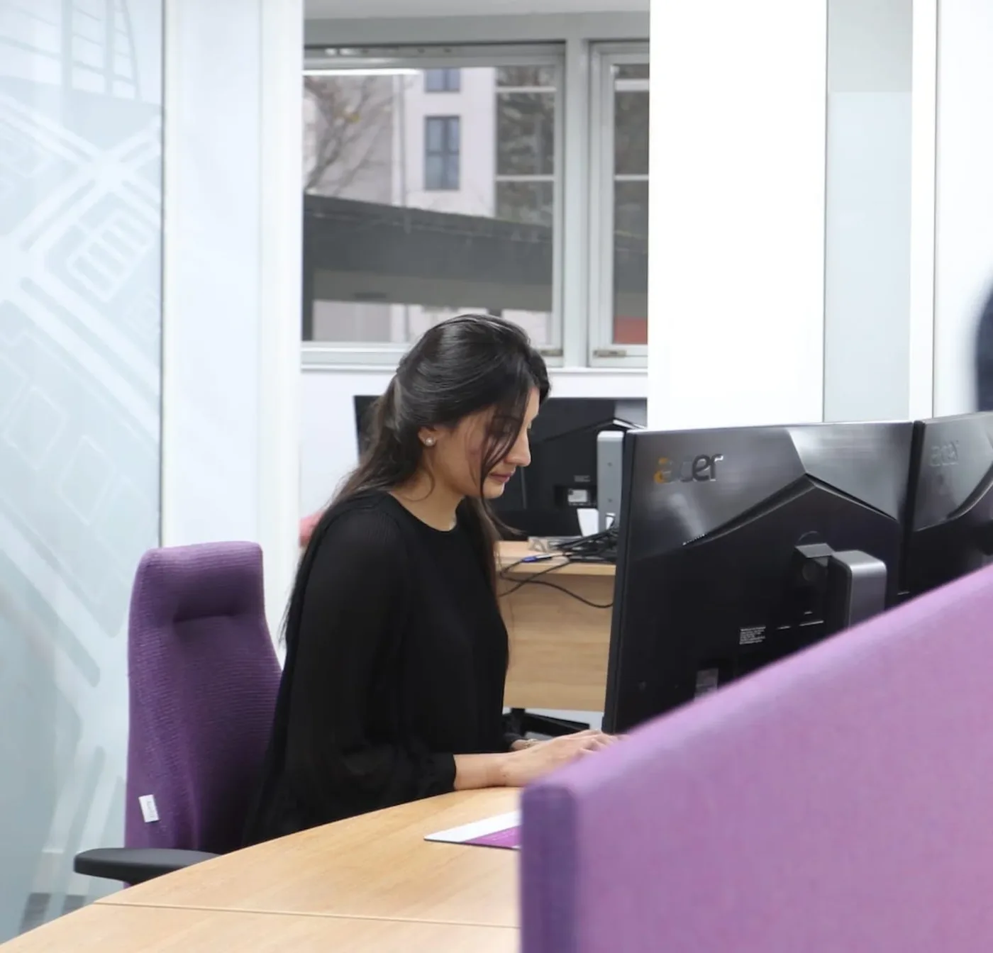 A member of the Fullers Family Law team working at her desk