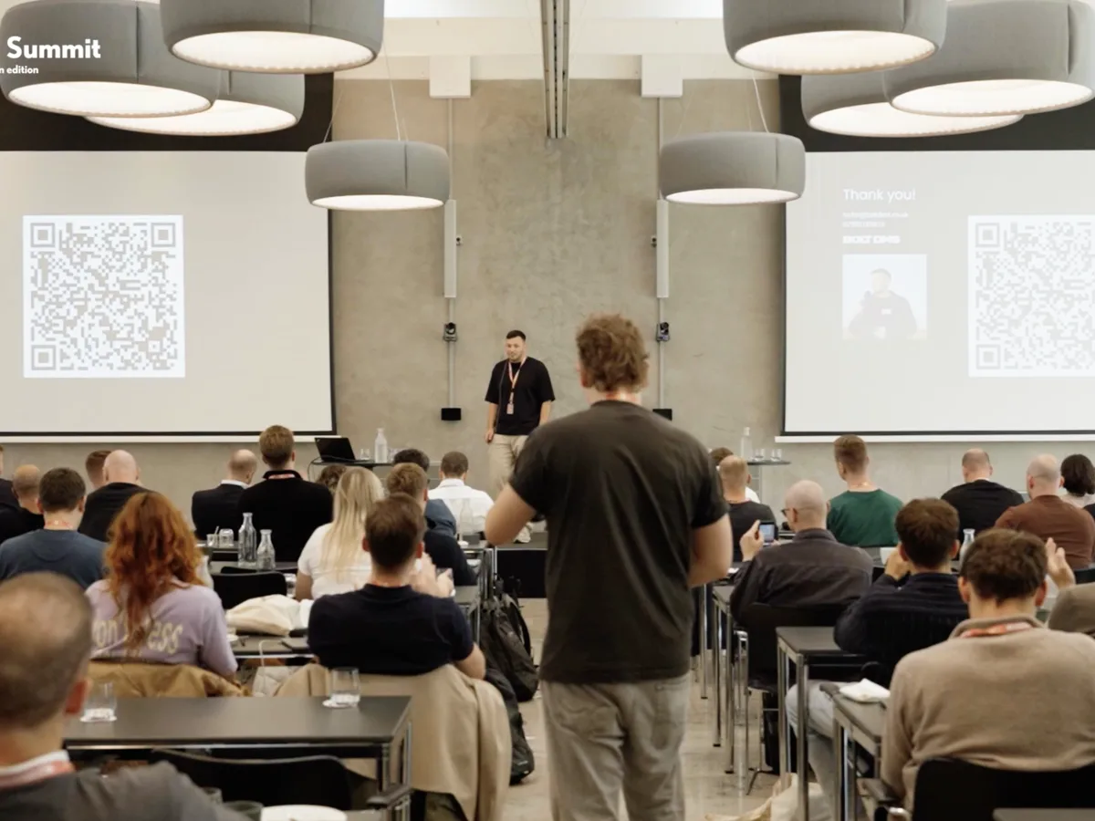Taylor presenting on stage to the room at PPC Hub Summit Copenhagen 2025