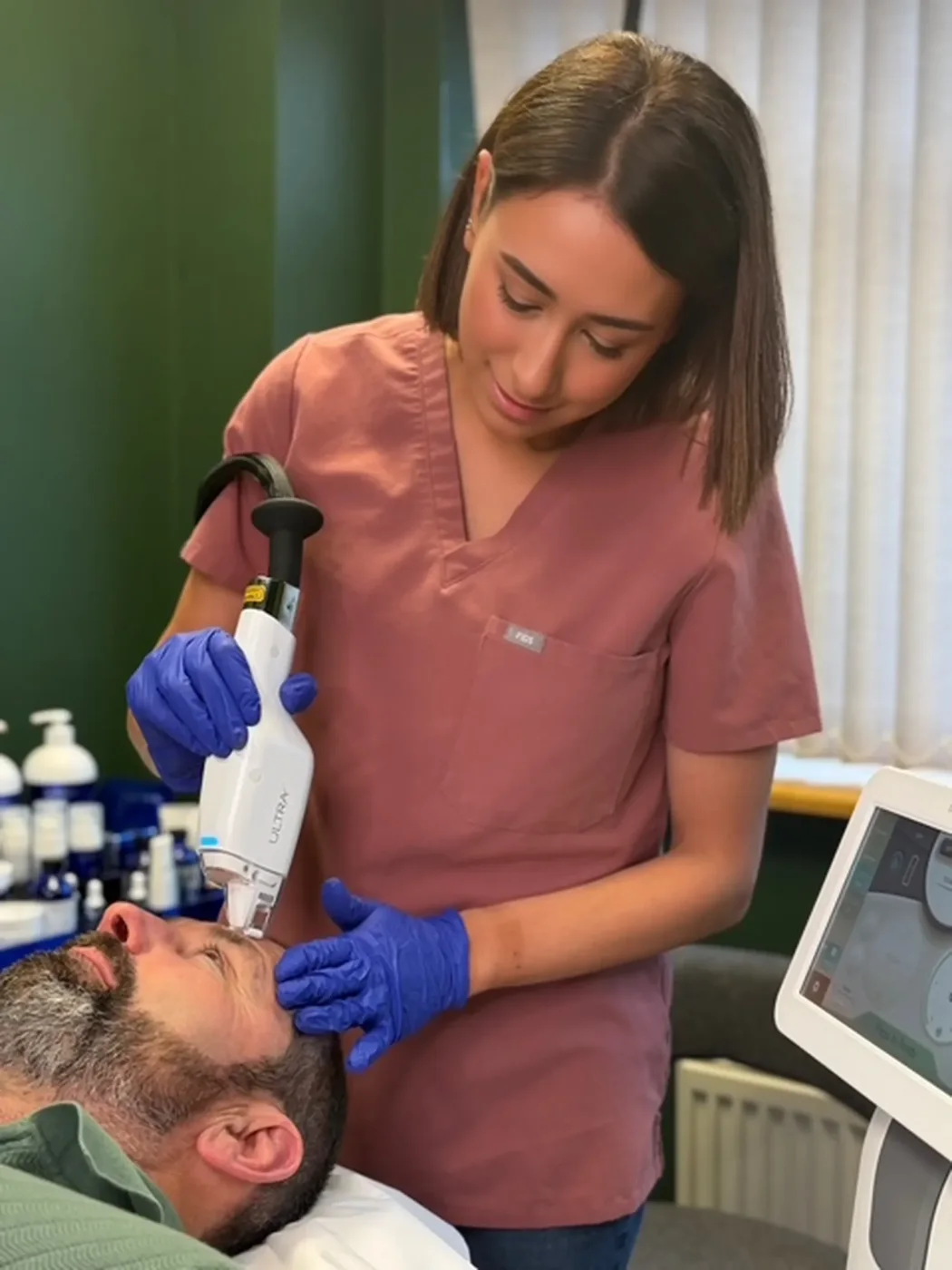 A practitioner carrying out a treatment at The AL5 Aesthetics